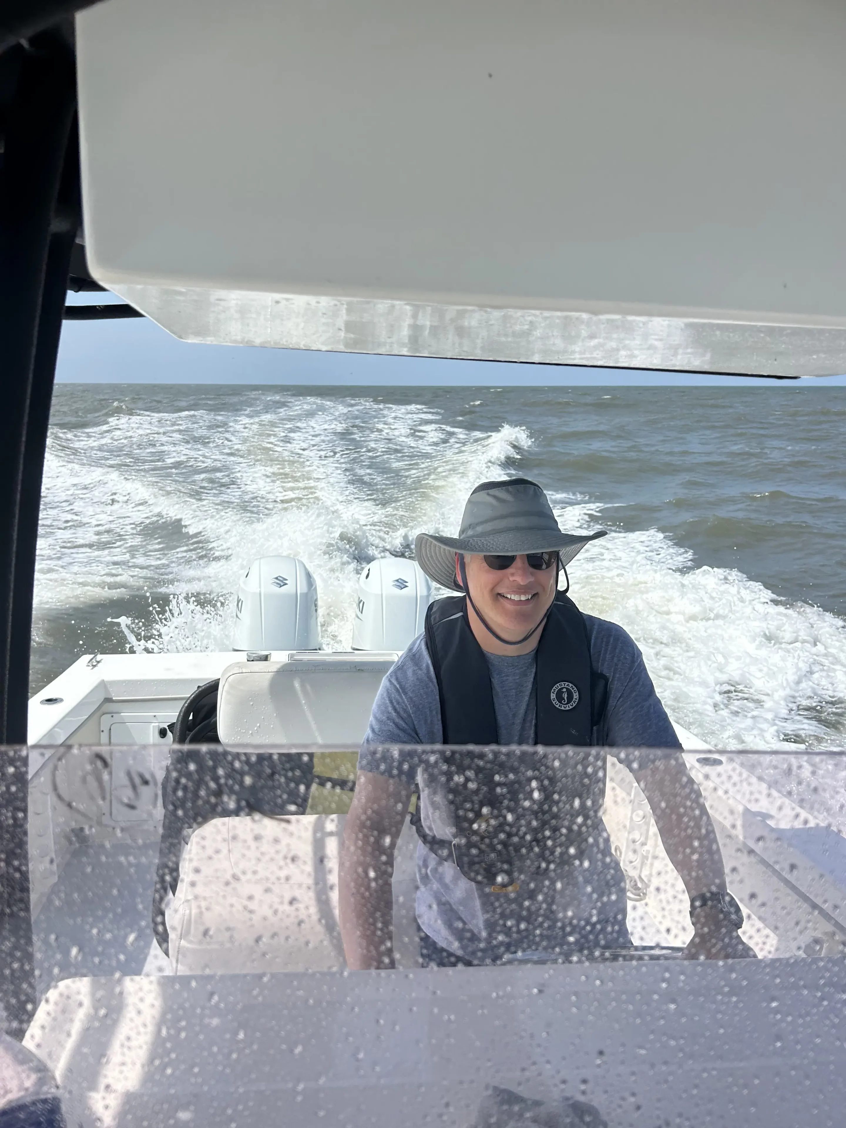Man enjoys boating on sunny day