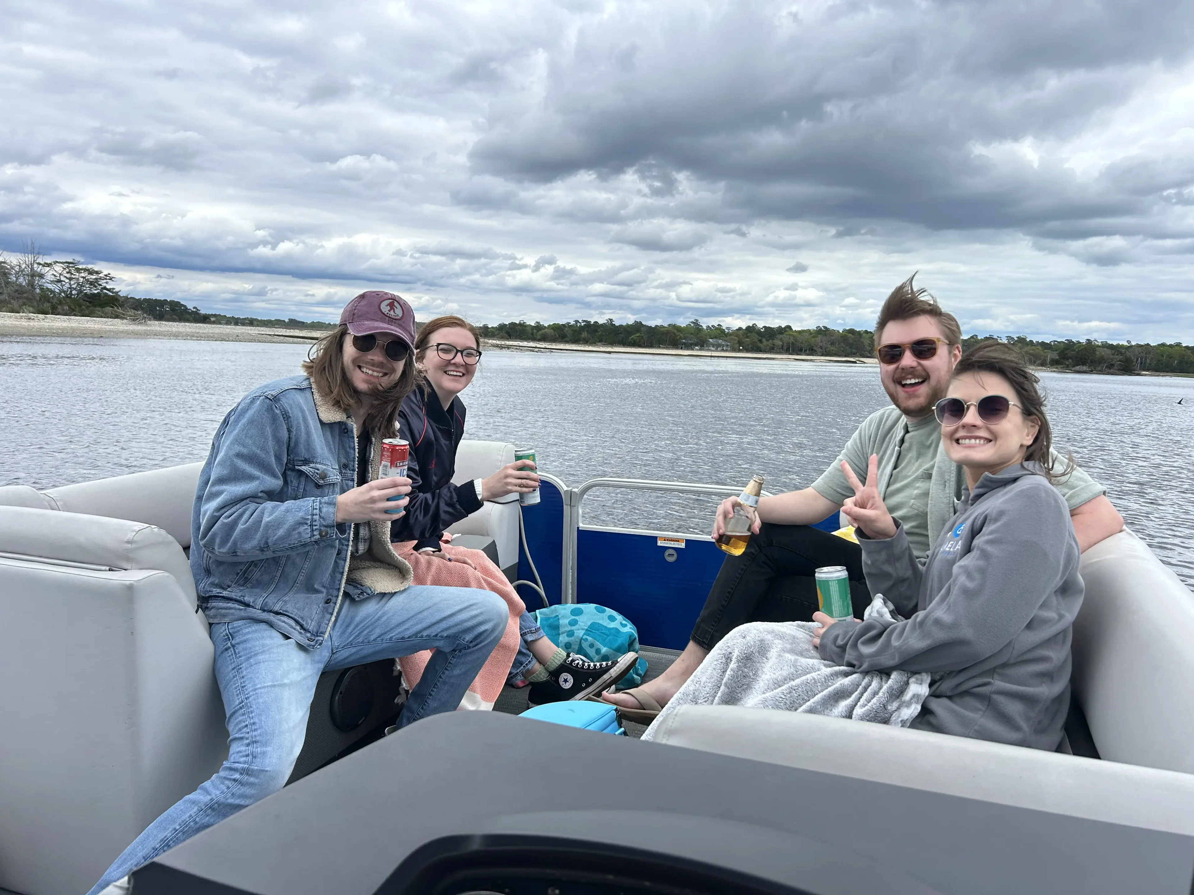 Friends enjoying drinks on a boat