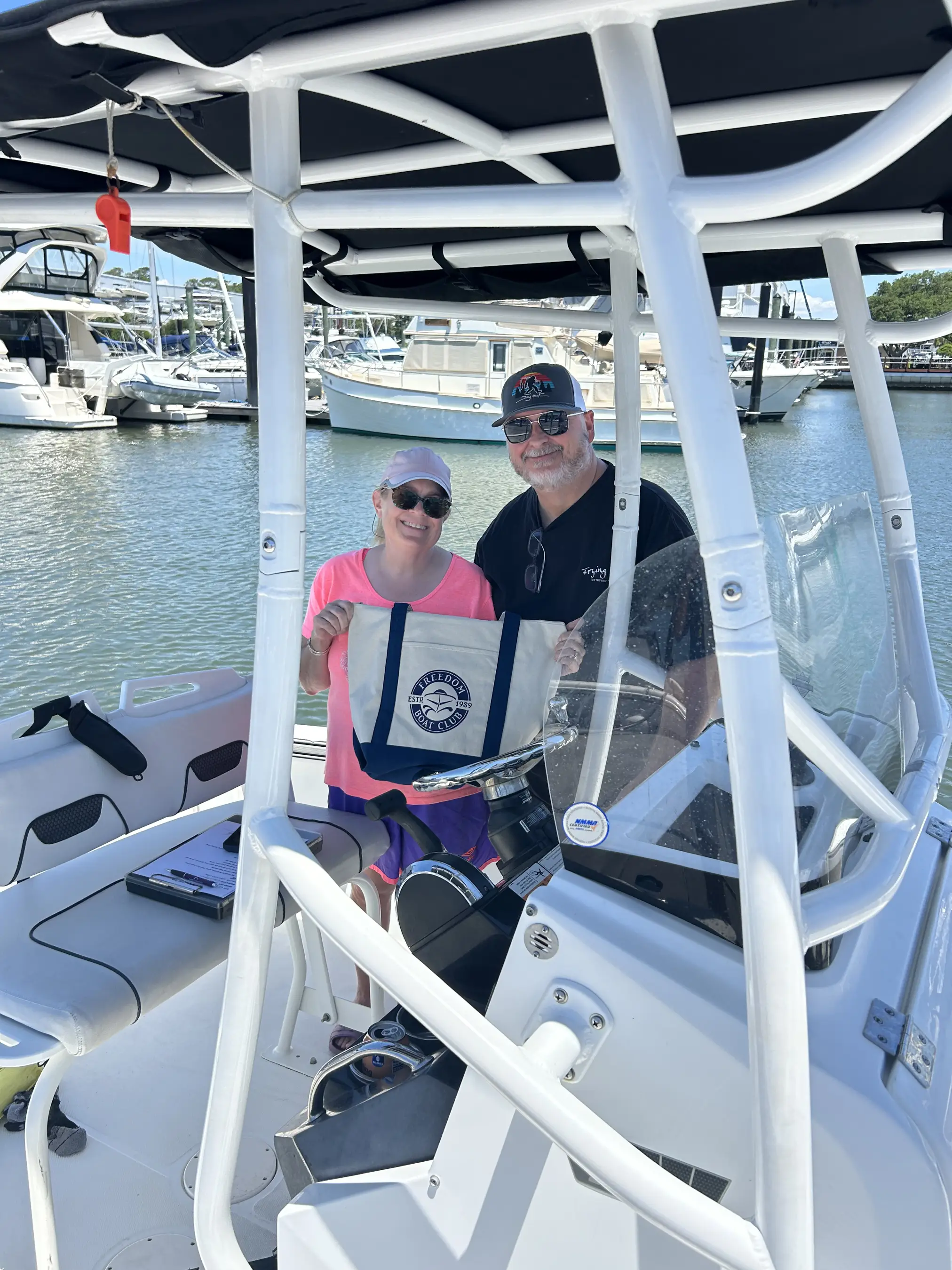 Couple holding a bag on a boat