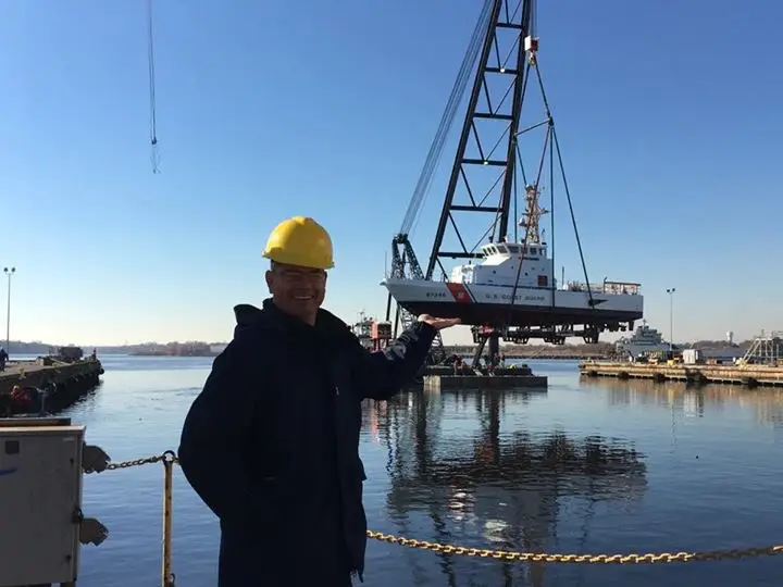 Worker at dock with crane
