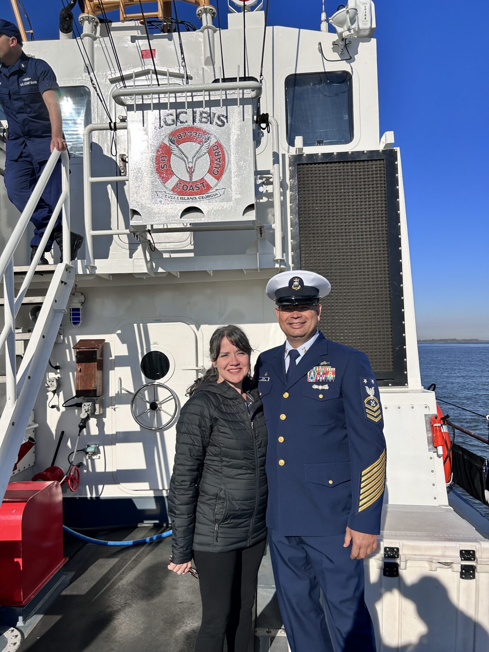 Man and woman on a ship deck.