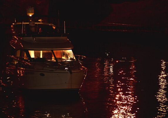 Nighttime boat scene with glowing lights