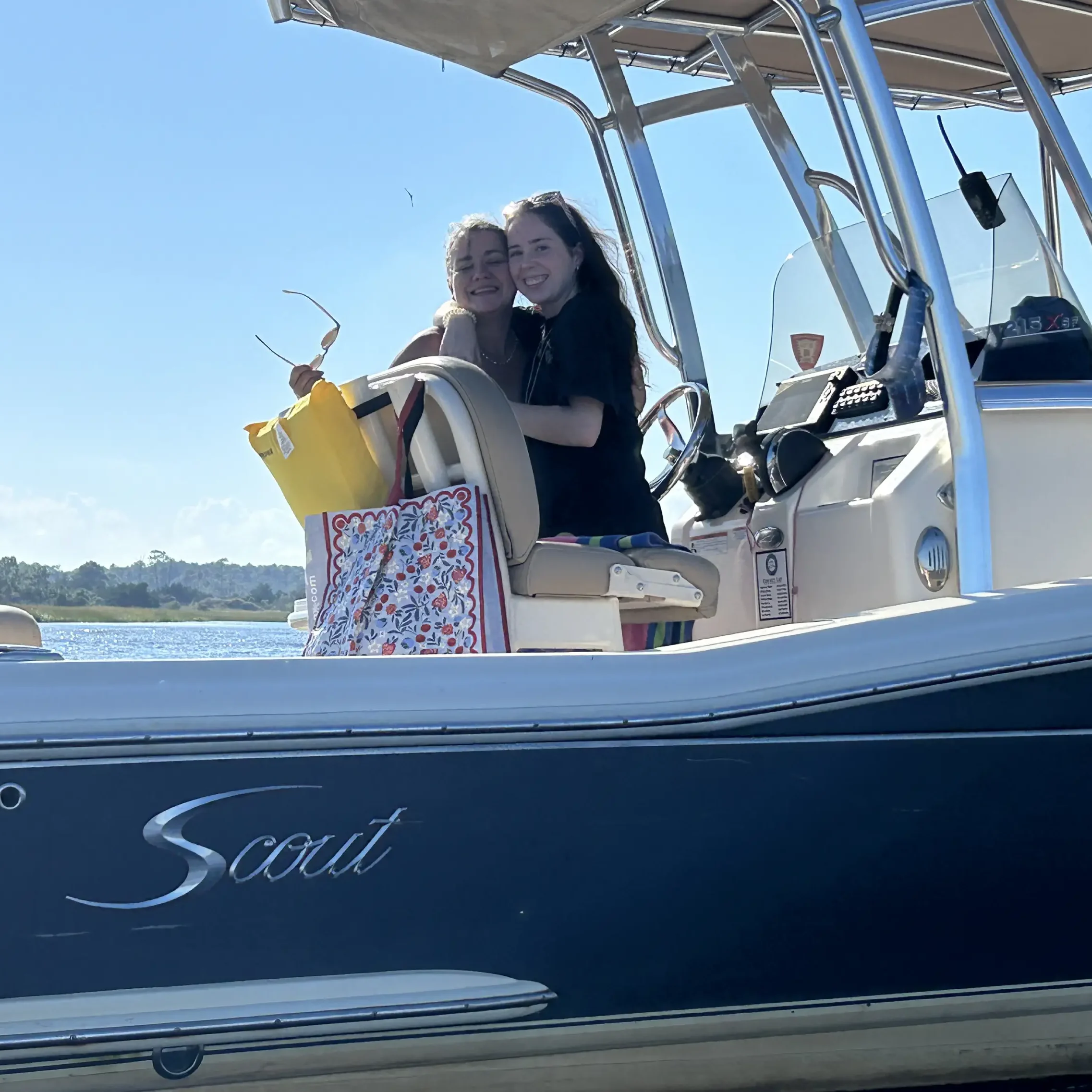 Two friends aboard a Scout boat